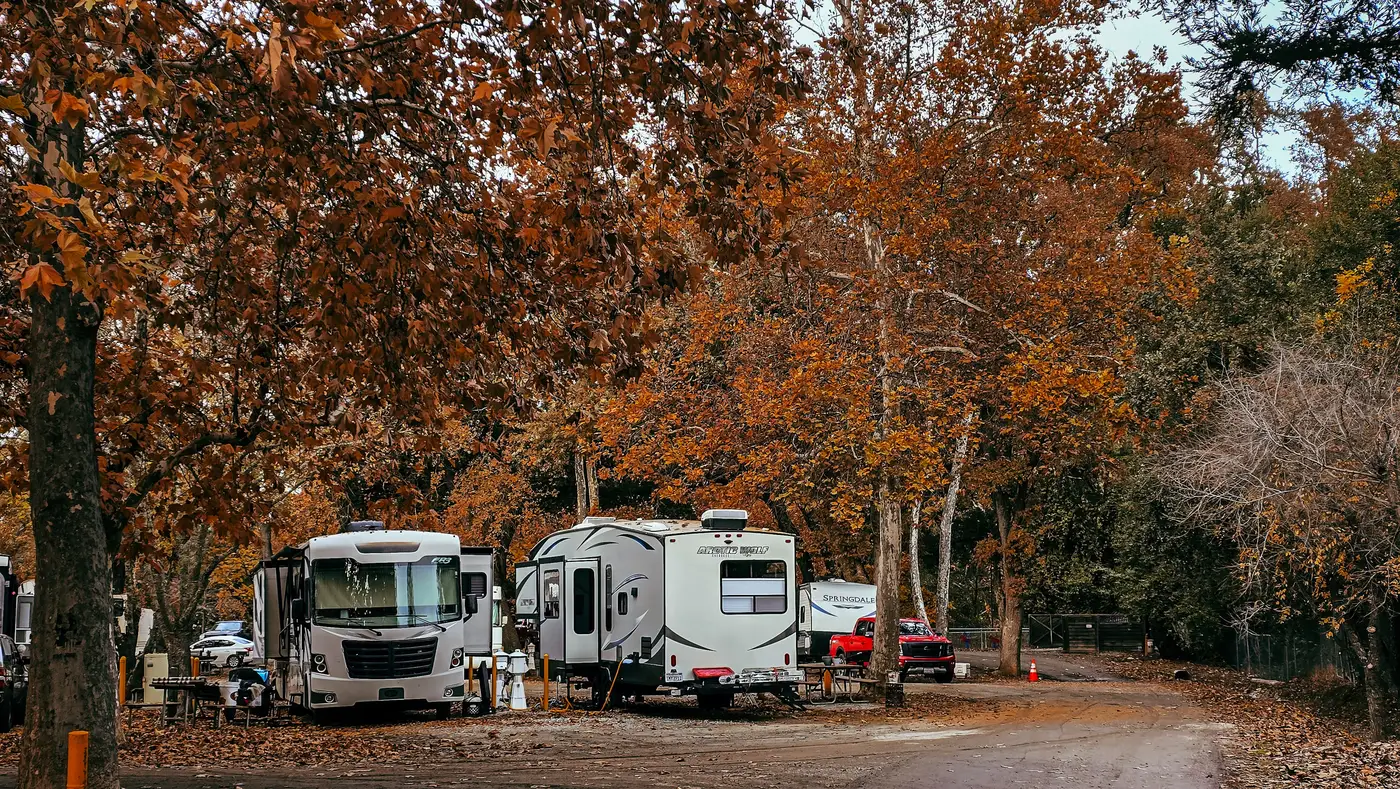 An electrical hookup post with outlets and breakers at an RV campsite
