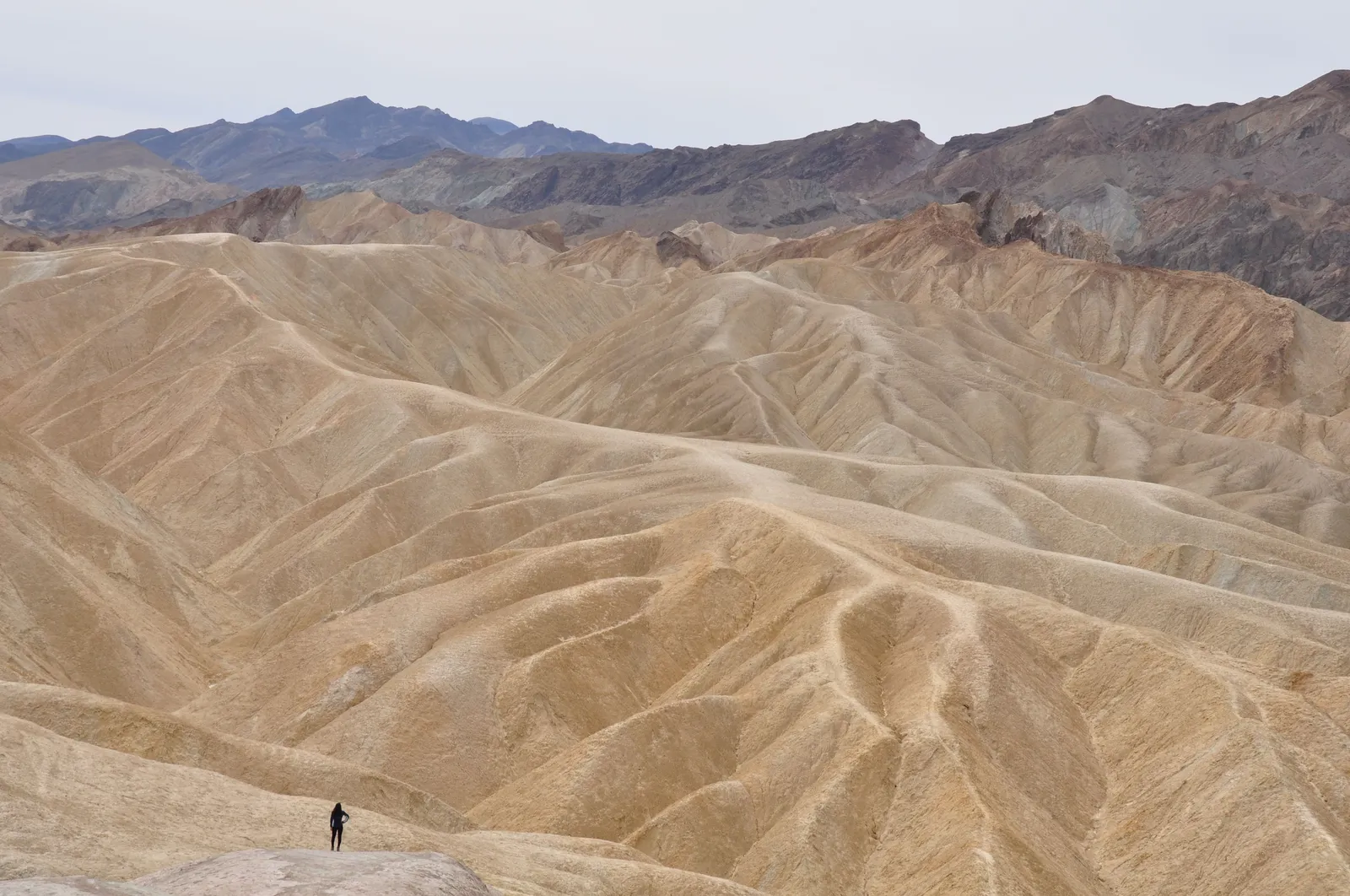 Salt flats and desert mountains in Death Valley under low winter light