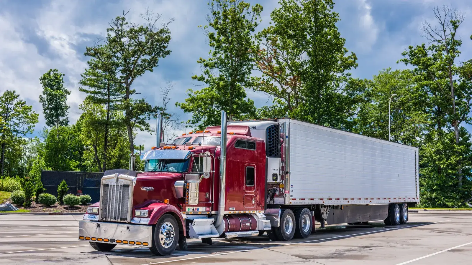 A semi truck parked at a highway rest area