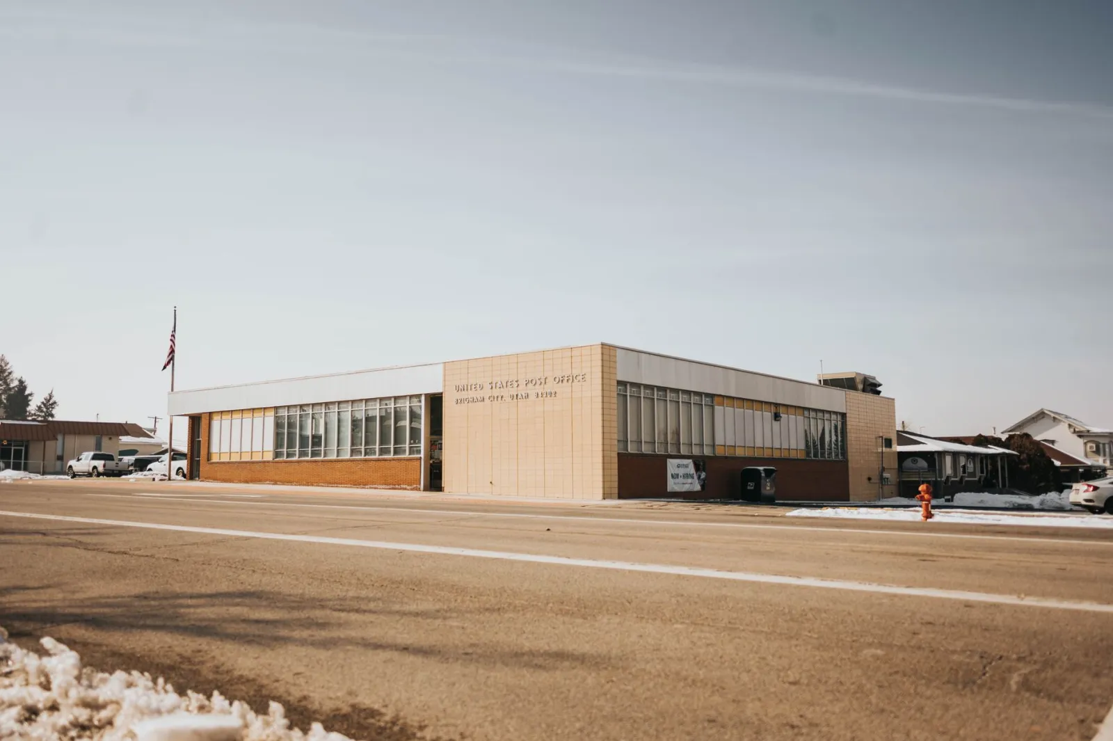 United States Post Office building in a small town with snow on the ground
