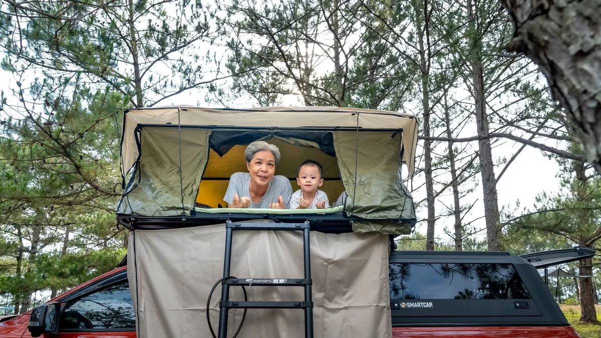 A rooftop tent open on a vehicle