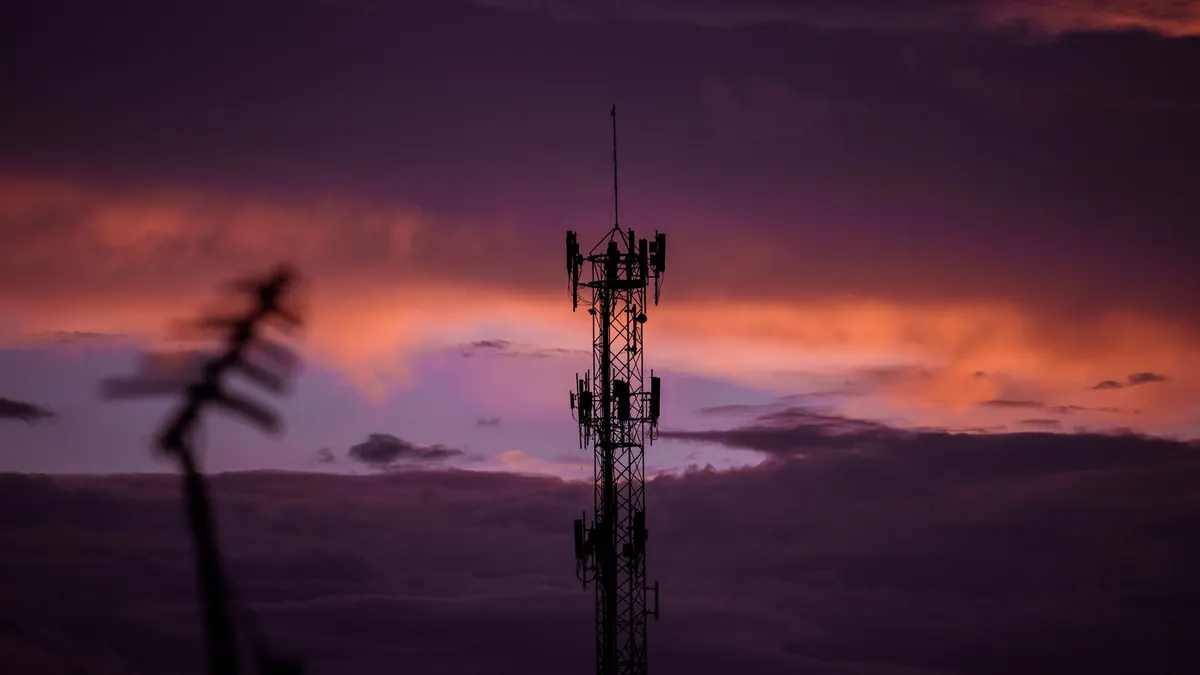 A cell tower on a distant hill