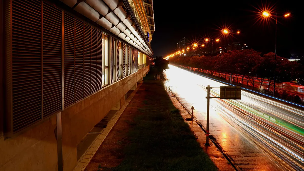 A highway rest area lit at night