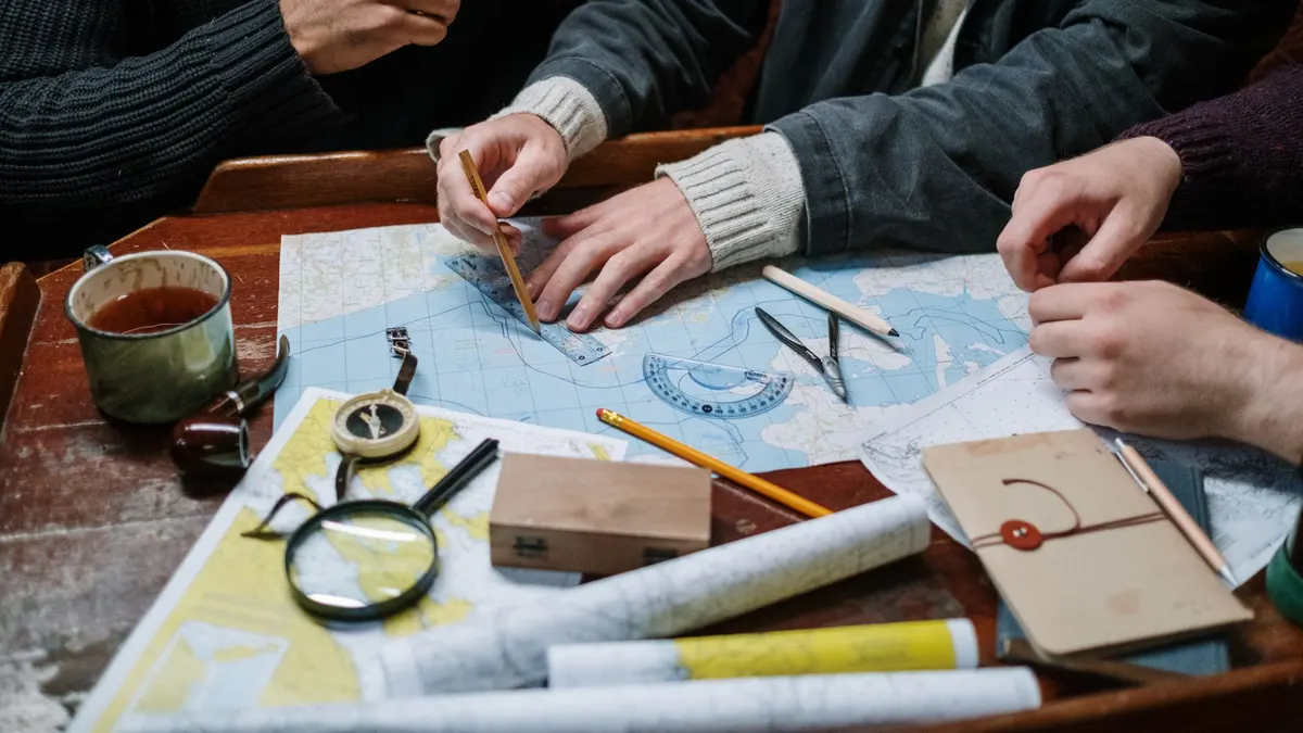 Paper map spread on a truck hood